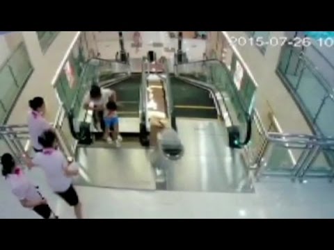Man watches wife die in China escalator accident