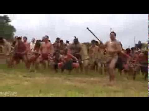 Hundreds of Maori warriors in battle haka