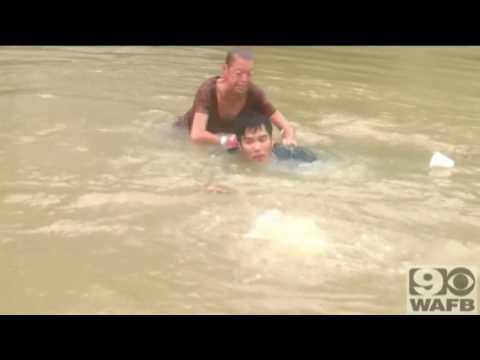 Video: Woman, dog rescued from sinking car in Louisiana flood