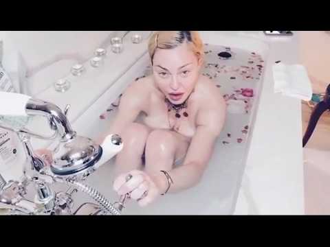 &#039;Covid is the great equaliser&#039; says Madonna from a petal filled bath
