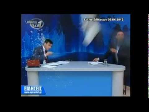 Greece Protesters Egg Newscaster on Live TV (Raw Video)