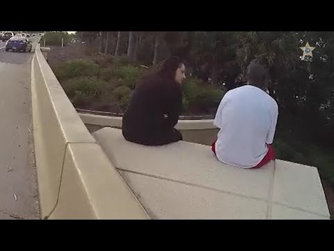 Woman uses Linkin Park lyrics to comfort man on overpass ledge