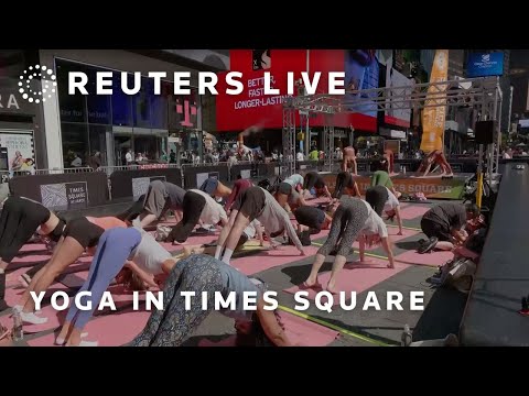 LIVE: People practice yoga in New York&#039;s Times Square