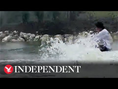 Florida man wakeboards down street in Hurricane Ian floodwaters