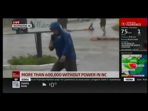 Weather Channel&#039;s Mike Seidel bravely fights hurricane wind as 2 guys calmly walk behind him