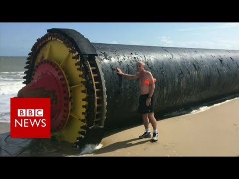 Giant pipes wash up on beaches - BBC News