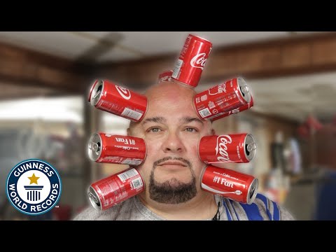 Why do cans stick to his skin? - @Guinness World Records