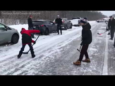 Drivers in Canada play hockey while stuck on highway