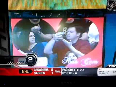 Guy chooses beer on kiss cam