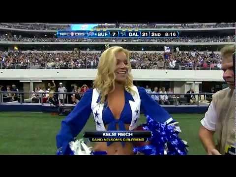 David Nelson hugs cheerleader Kelsi Reich