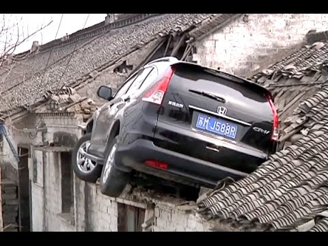 SUV Crashes into House Roof after Mistaking Accelerator for Brake