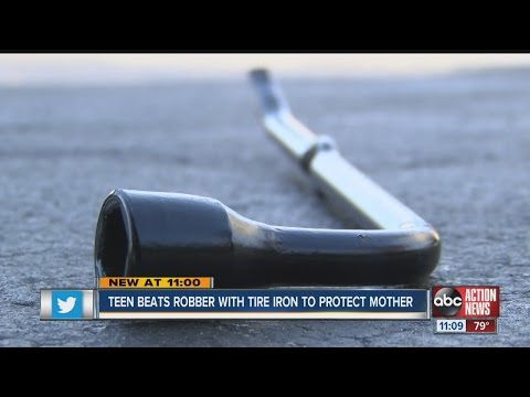 Teen hits armed robber with tire iron, body slams him in order to protect family