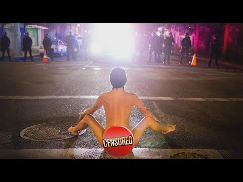 Naked Protester Does Yoga Poses in Front of Cops