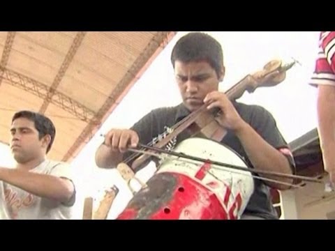 Children&#039;s Orchestra Play Instruments Made from Trash