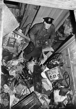 Policeman Searching Through Debris In Mansion (Custom)