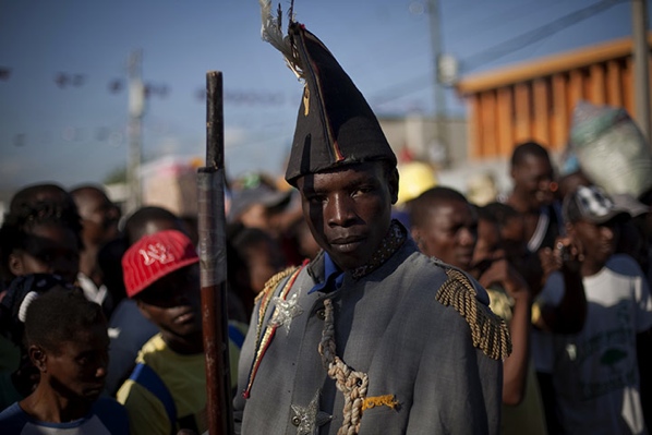 Port-Au-Prince-Haiti-A-Man-Dressed-As-A-Colonial-Soldier-Parades-During-A-Ceremony-To-Mark-The-205Th-Anniversary-Of-The-Killing-Of-Jean-Jacques-Dessalines-A-Leader-Of-The-Haitian-Revolution-Against-France