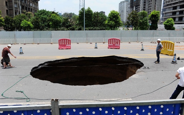 This-Huge-Sinkhole-Suddenly-Appeared-On-A-Main-Road-In-Changsha-Capital-Of-Southern-Chinas-Hunan-Province.-The-Enormous-Hole-Opened-Up-At-Around-1Am-And-Swallowed-Up-A-Car-Killing-One-And-Injuring-A-Further-Three-People.