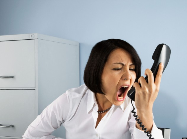 Businesswoman shouting at telephone. Image shot 2008. Exact date unknown.