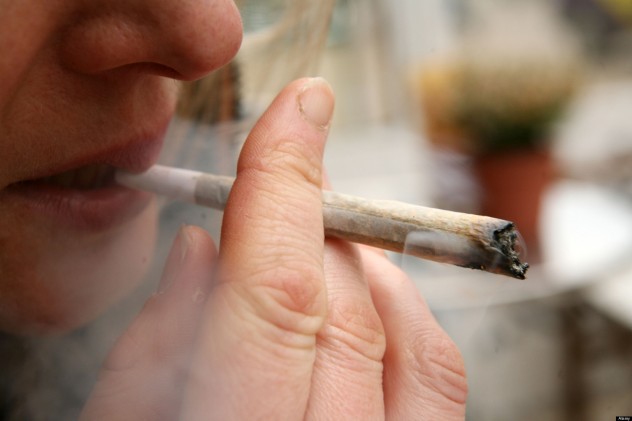 young woman smoking marijuana in a coffee shop in holland