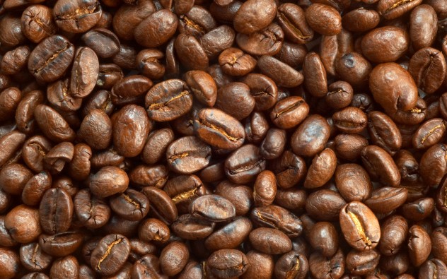 textured background: brown roasted coffee beans macro closeup