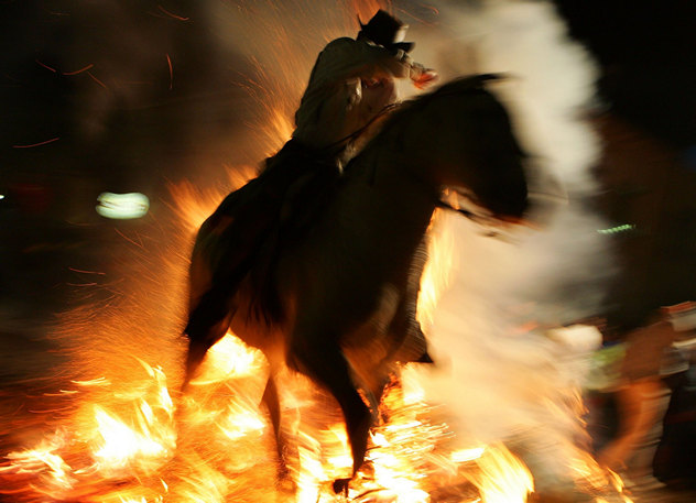Spanish Horsemen Leap Bonfires To Celebrate Feast Of St Anton