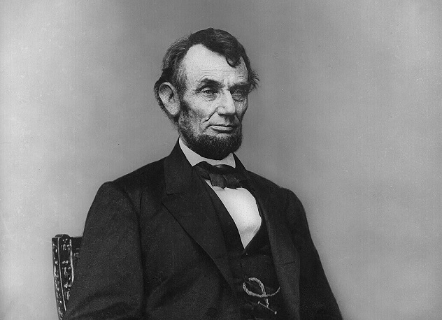 Abraham_Lincoln_seated,_Feb_9,_1864