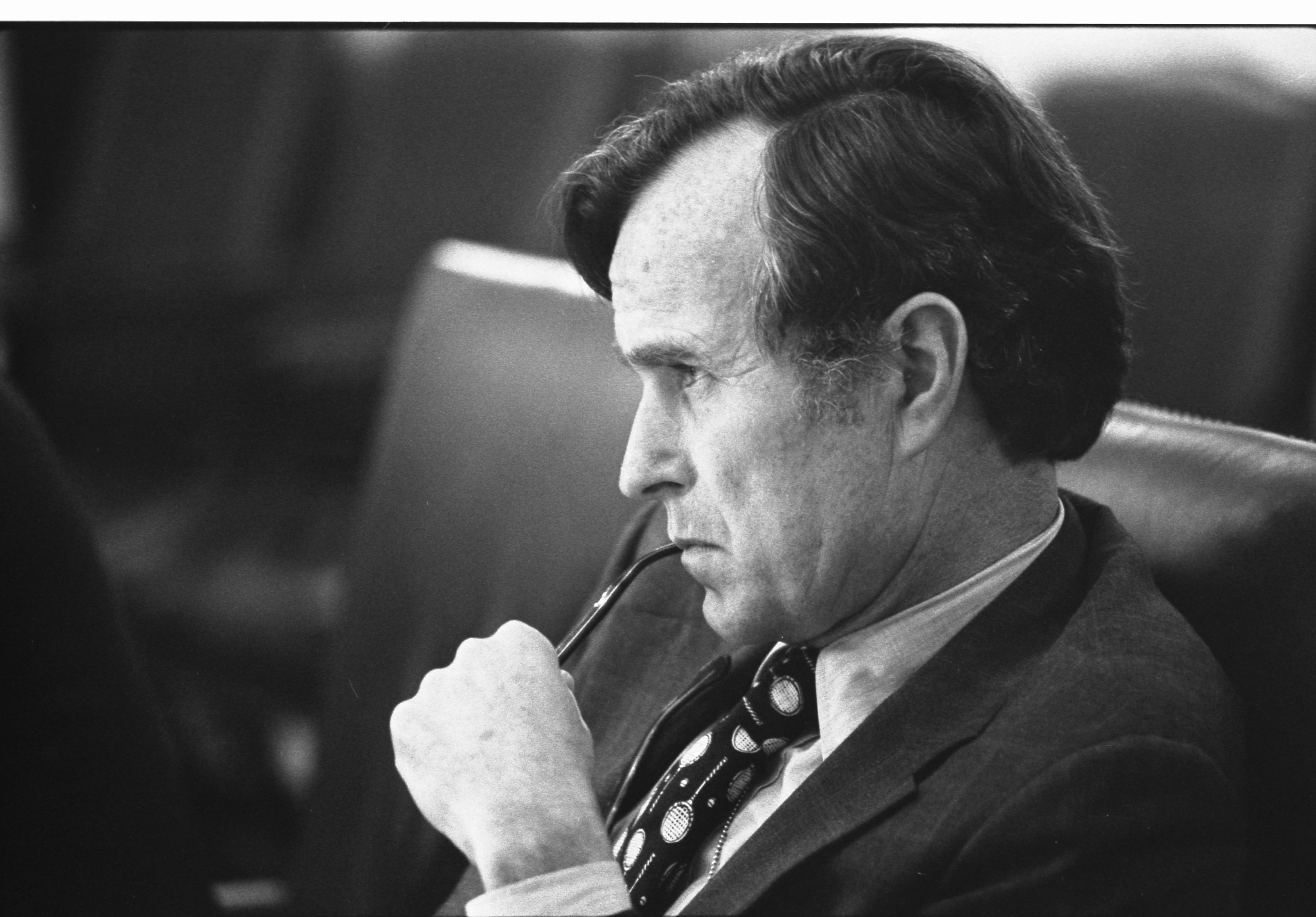 CIA_Director_George_H.W._Bush_listens_at_a_meeting_following_the_assassinations_in_Beirut,_1976_-_NARA_-_7064954