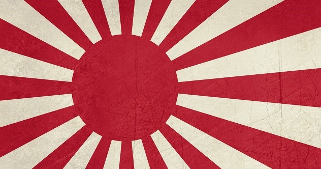 Grunge Rising Sun ensign of Japanese navy in red and white.