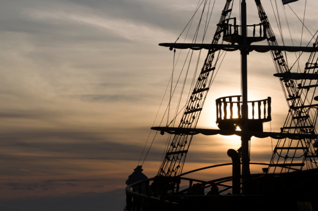 Silhouette of sails of an antique ship, masts and bowsprit of a