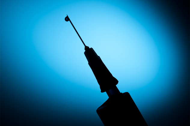 Syringe for a blood test or drug addiction theme