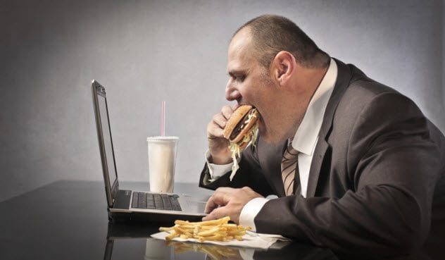 9a-obese-man-using-computer-155511848