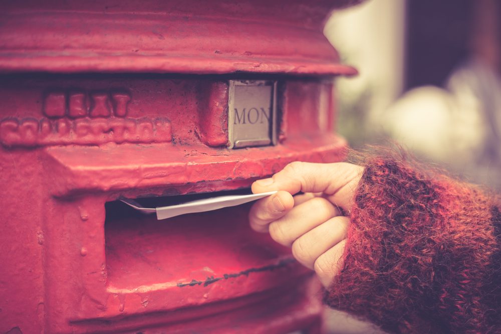 A letter lying on a city pavement